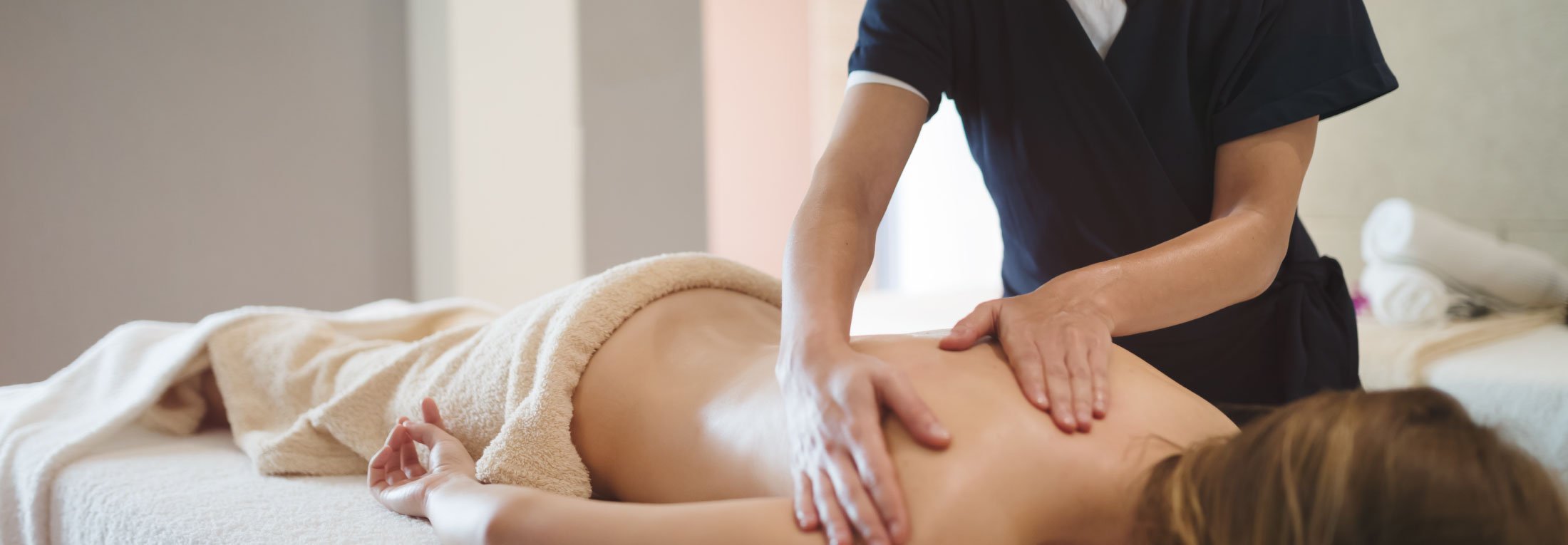 Woman getting a deep tissue back massage