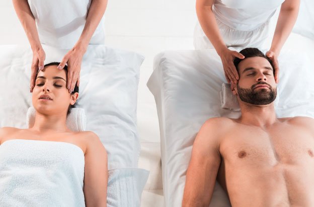 couple getting a massage together at a massage spa